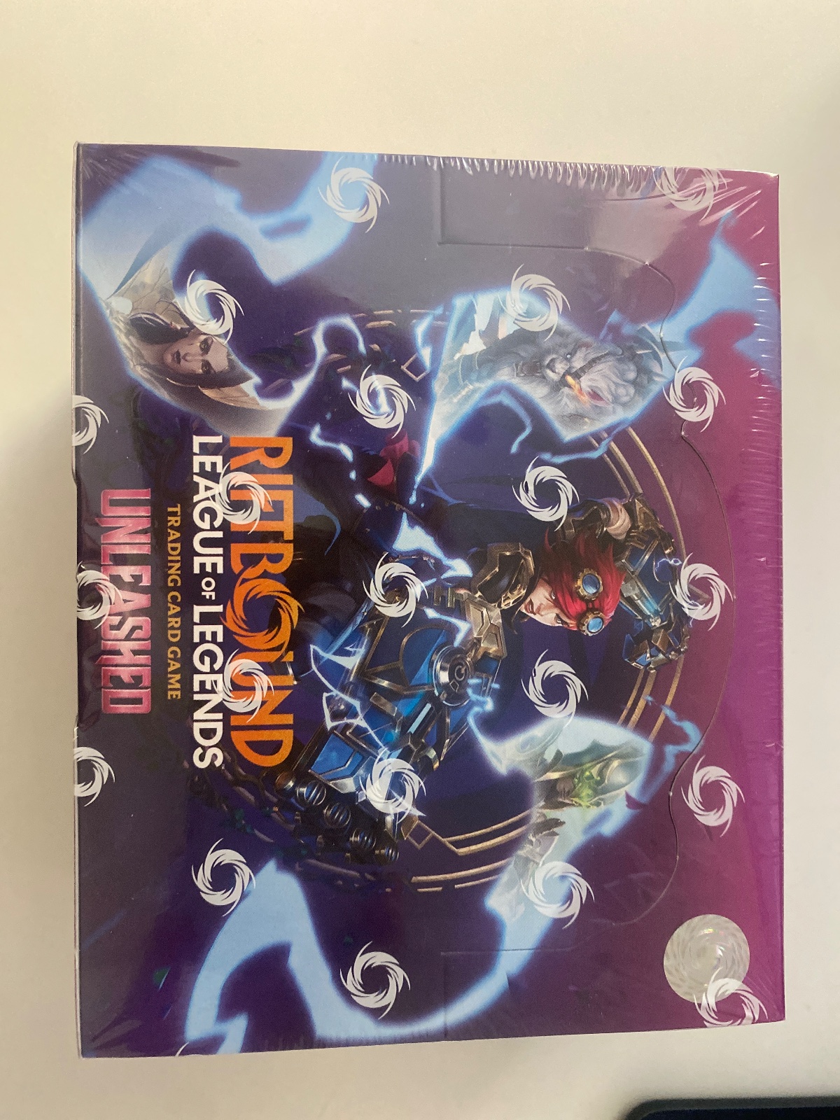 Sealed booster box of Riftbound Unleashed, English print.